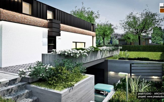 projekt dom jednorodzinny nowoczesny w Krakowie to dom na skarpie z garaż pod domem i garaż w skarpie