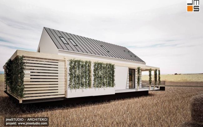 nowoczesny projekt domu modułowego na Śląsku z żaluzjami zewnętrznymi drewnianymi i pergolą