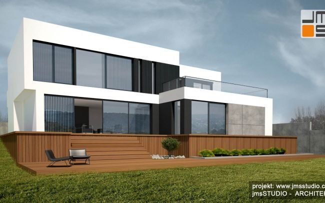 Projekt nowoczesnego energooszczędnego domu z dużymi oknami, prostą geometryczną elewacją i dużym tarasem na działce ze spadkiem pod Krakowem